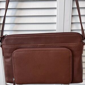 ili New York brown 100 leather exterior rfid protective travel purse.